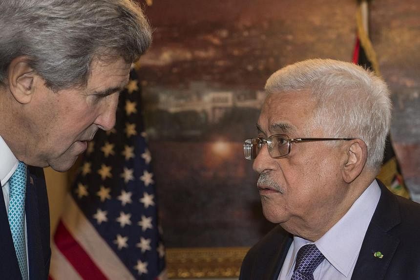 US Secretary of State John Kerry (left) meets with Palestinian President Mahmoud Abbas at his residence in Amman on Nov 13, 2014 to discuss the upsurge in violence in east Jerusalem and the West Bank. Kerry arrived in Jordan late on Nov 12 for talks 