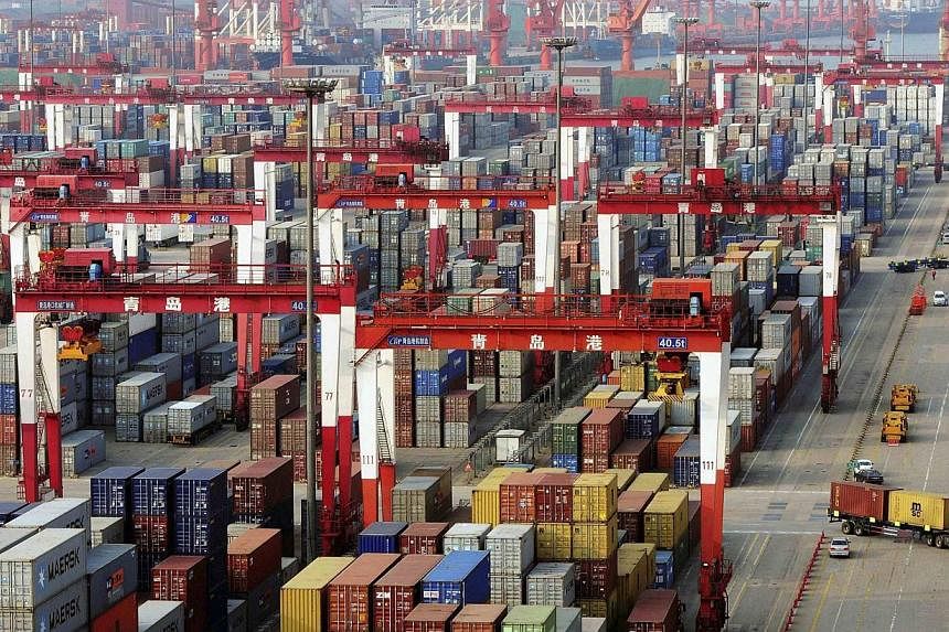 Shipping containers at the port in Qingdao, China. -- PHOTO: REUTERS