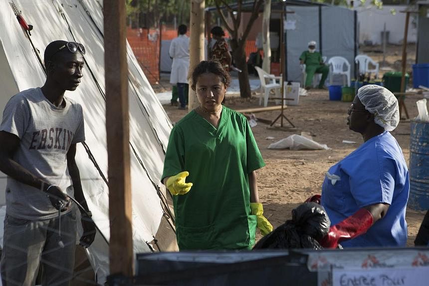 Health workers work at an Ebola treatment center in Bamako, Mali, on Nov 13, 2014.&nbsp;Mali is tracing at least 200 contacts linked to confirmed and probable Ebola victims as it seeks to control its second Ebola outbreak, health officials said on Fr
