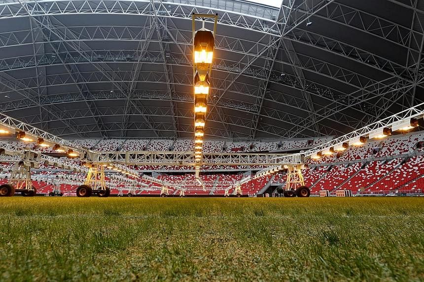 To stimulate the growth of its rye and blue grass seeds, the Singapore Sports Hub has installed $1.5 million worth of special lighting equipment. -- ST PHOTO:&nbsp;SEAH KWANG PENG