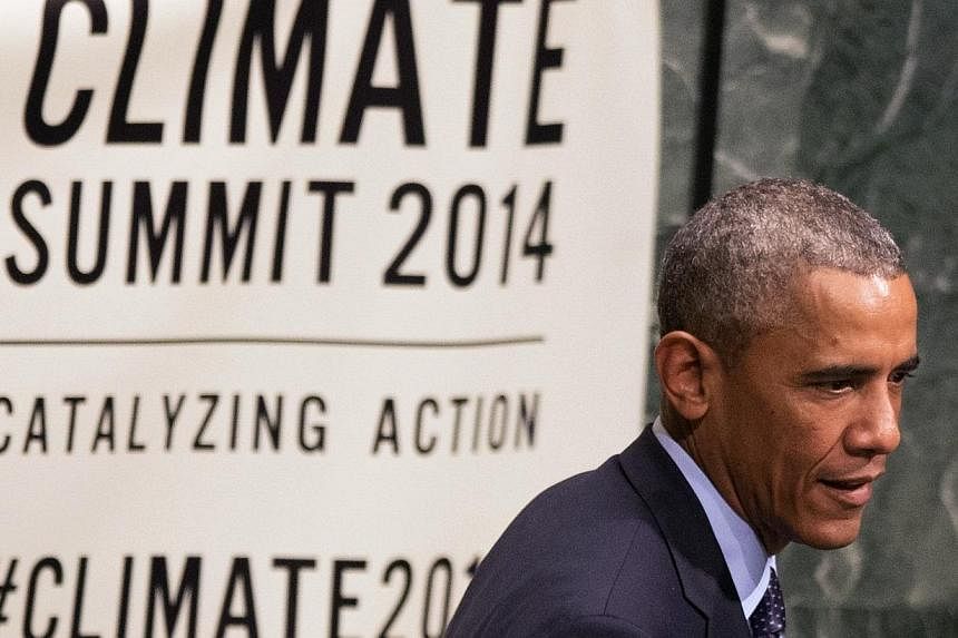 US President Barack Obama will pledge US$3 billion (S$3.75 billion) to a UN fund aimed at mitigating the effects of climate change in the world's poorest countries, a US official said Friday. -- PHOTO: REUTERS