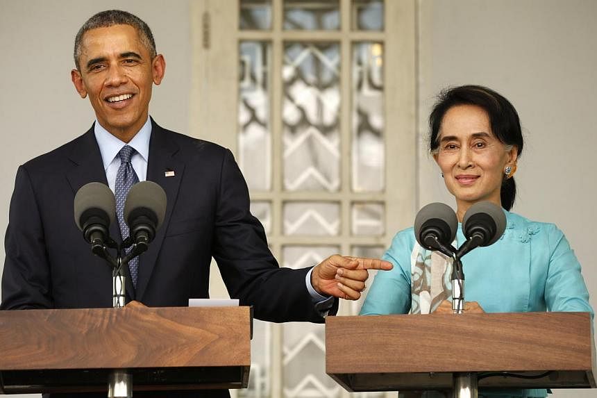 US President Barack Obama and opposition politician Aung San Suu Kyi hold a press conference after their meeting at her residence in Yangon, on Nov 14, 2014.&nbsp;Opposition leader Aung San Suu Kyi on Friday described Myanmar's constitution as "unfai