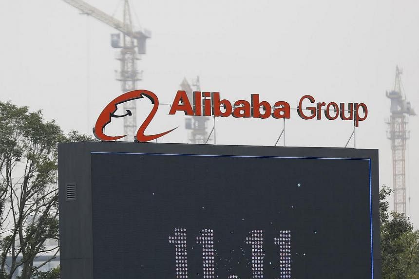 The logo of the Alibaba Group is seen inside the company's headquarters in Hangzhou, Zhejiang province on Nov 11, 2014. -- PHOTO: REUTERS