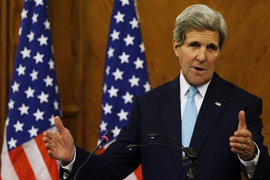 US Secretary of State John Kerry speaks during a joint news conference with Jordan's Foreign Minister Nasser Judeh at the Ministry of Foreign Affairs in Amman Nov 13, 2014.Kerry said Thursday that steps were agreed at talks in Amman to lower tensions