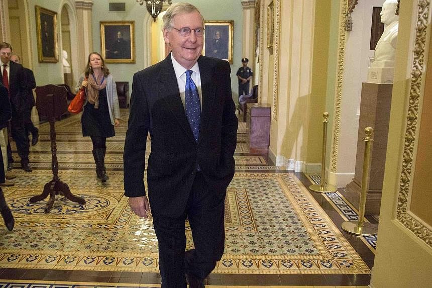 Senate Minority Leader Mitch McConnell arrives at his office before a closed conference meeting to conduct leadership elections for the next Congress on Capitol Hill in Washington Nov 13, 2014. Senate Republicans on Thursday unanimously elected Mitch
