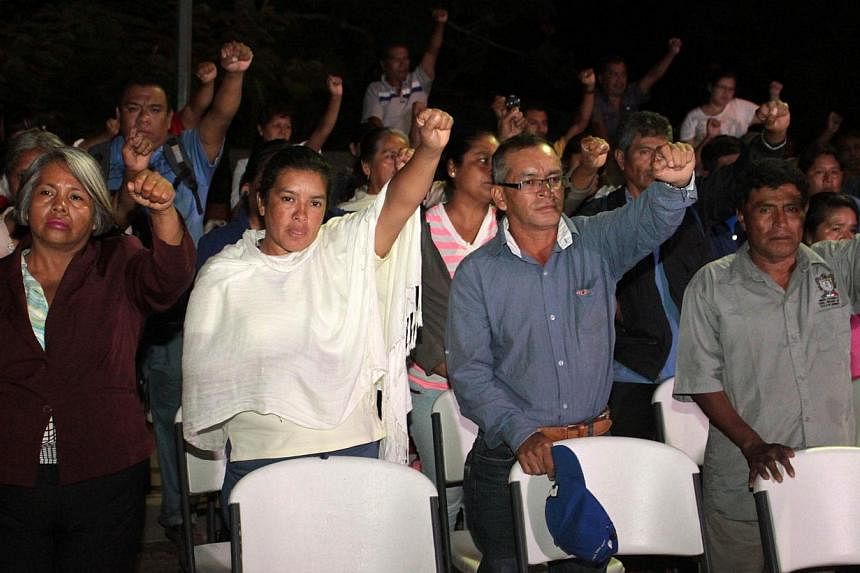 Parents and relatives of the 43 Mexican missing students attend a press conference in Ayotzinapa, Guerrero state on Nov 12, 2014, to announce they will lead three caravans to three different states of Mexico to demand that authorities find the studen