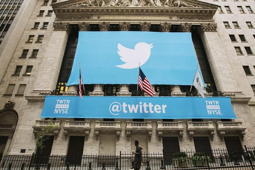A sign displays the Twitter logo on the front of the New York Stock Exchange ahead of the company's IPO in New York in this Nov 7, 2013 file photo.&nbsp;Standard &amp; Poor's gave Twitter's recent US$1.8 billion (S$2.3 billion) debt issue a "speculat