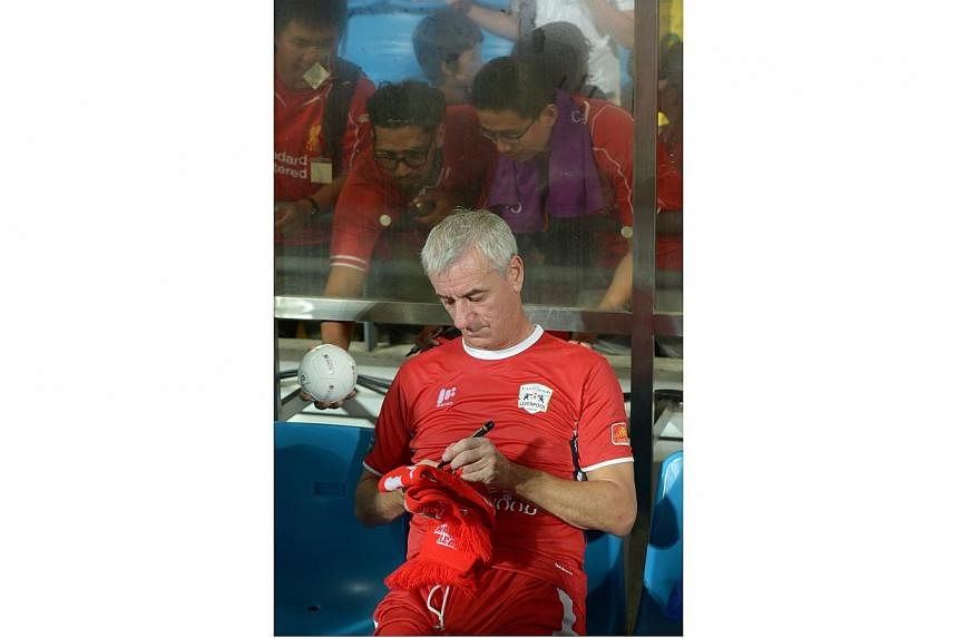Ian Rush signing autographs for fans at the Castlewood Group Liverpool Masters. -- ST PHOTO: DESMOND WEE