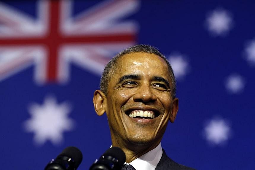 US President Barack Obama smiles broadly as he takes the stage to speak at the University of Queensland in Brisbane on Nov 15, 2014. -- PHOTO: REUTERS