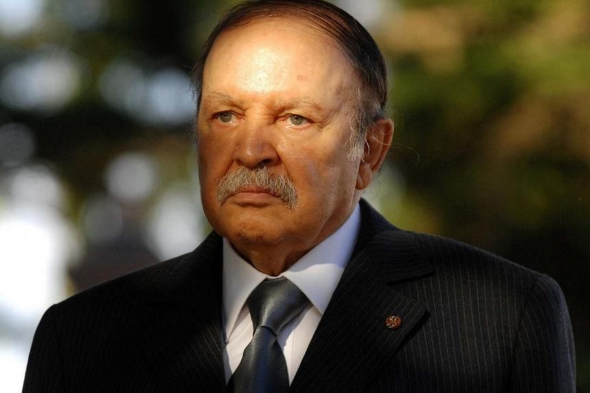 A file picture taken on Dec 11, 2011 shows Algerian President Abdelaziz Bouteflika waiting to greet the Mauritanian president upon his arrival in Algiers. Bouteflika, 77, has been hospitalised in a clinic in Grenoble, French Alps, a source said on No