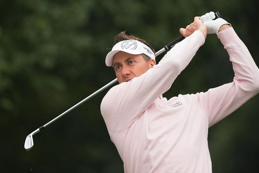 Ian Poulter of England tees off at the 5th hole during the 3rd day of the WGC-HSBC Champions Golf tournament in Shanghai on Nov 8, 2014. -- PHOTO: AFP