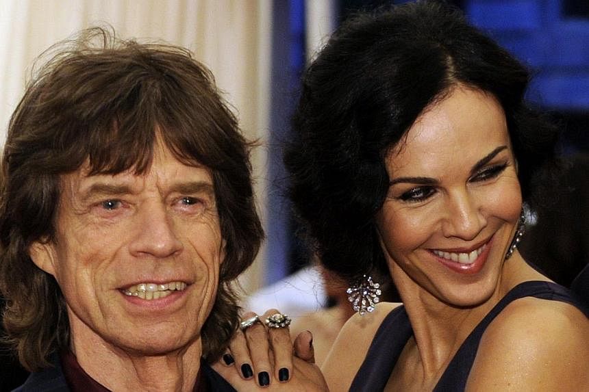 Musician Mick Jagger (left) and L'Wren Scott attend the Costume Institute Benefit at The Metropolitan Museum of Art in New York on May 7, 2012. -- PHOTO: AFP