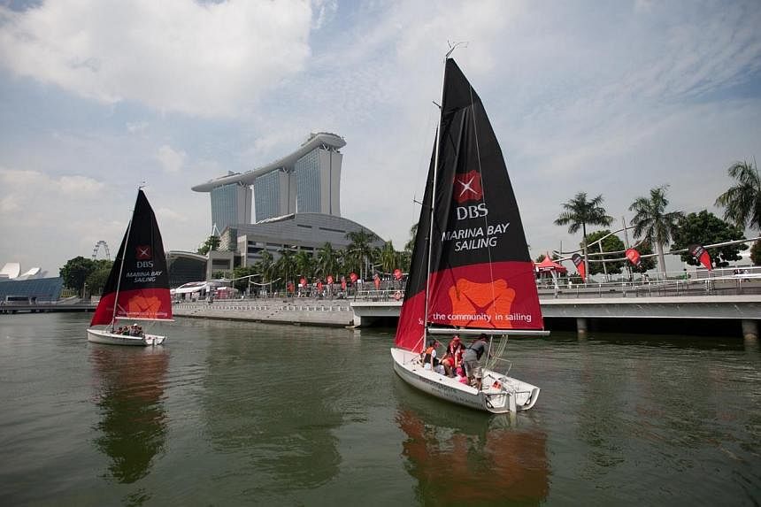 Sailboats sailing on Marina Bay, as part of the festivities of the DBS Marina Regatta 2013.&nbsp;DBS Bank announced yesterday a $3.5 million sponsorship for next year's Singapore SEA Games, as well as its dragon boat and sailing races. It will also b