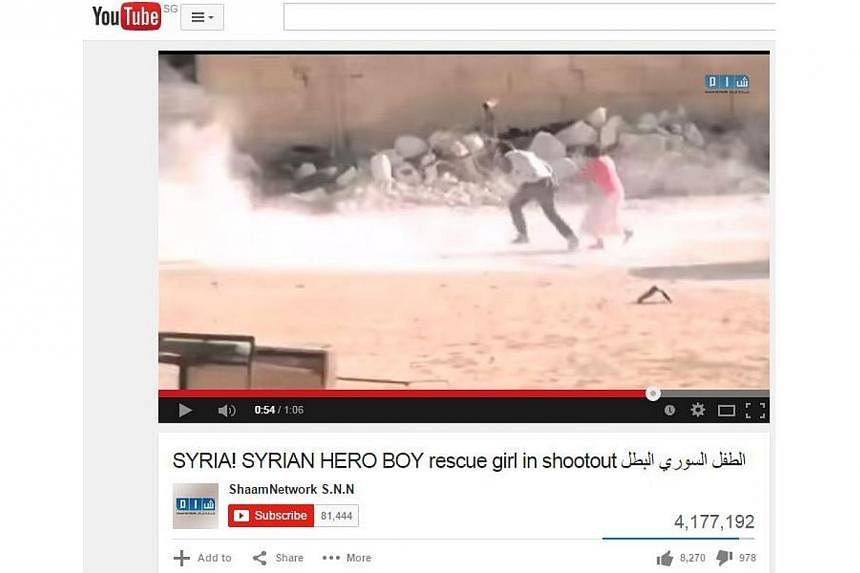 The producer of a viral video showing a Syrian boy rescuing a girl under gunfire apologised Sunday after the revelation it was fake drew fierce criticism. -- PHOTO: SCREENGRAB FROM YOUTUBE