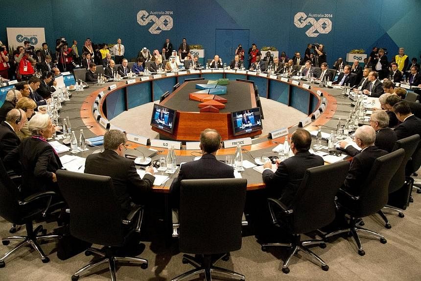 Leaders meet during a plenary session at the G20 leaders summit in Brisbane on Nov 15, 2014. Group of 20 (G-20) nations, which collectively comprise 85 per cent of the world economy, wrapped up their annual summit on Sunday (Nov 16, 2014) with agreem