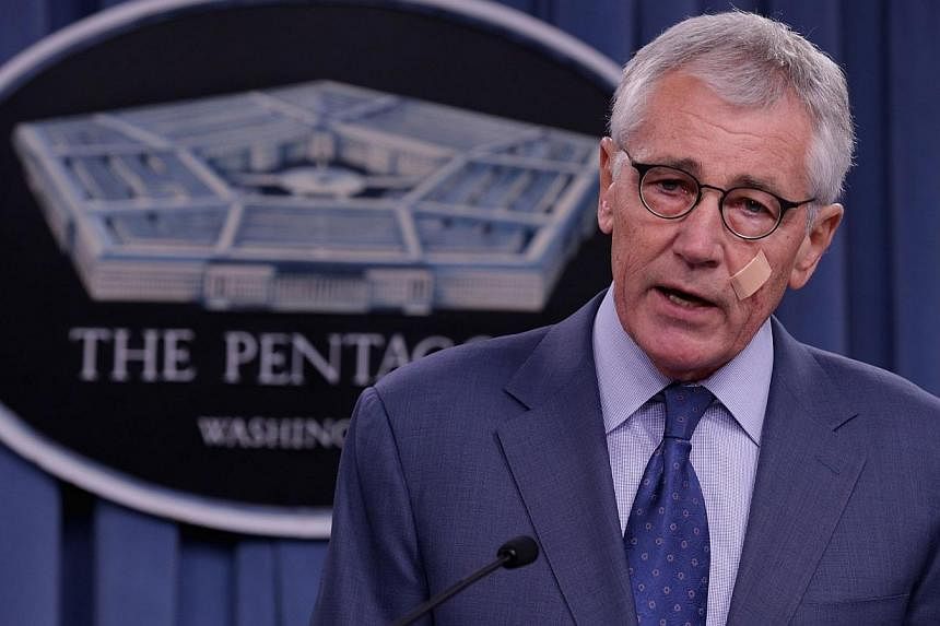 US Defense Secretary Chuck Hagel announces a series of reforms to the troubled nuclear force during a press briefing at the Pentagon in Arlington, Virginia on Nov 14, 2014. -- PHOTO: AFP