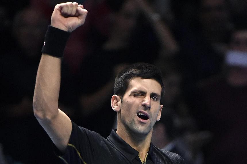Novak Djokovic of Serbia reacts after winning his semi-final tennis match against Kei Nishikori of Japan in London Nov 15, 2014. -- PHOTO: REUTERS