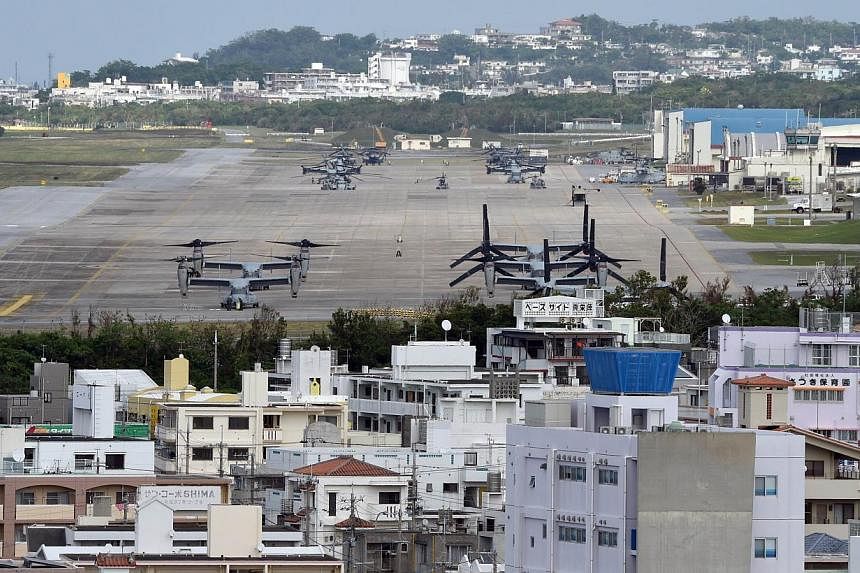 Osprey aircrafts at the US Marine's Camp Futenma in a crowded urban area of Ginowan, Okinawa prefecture. -- PHOTO: AFP