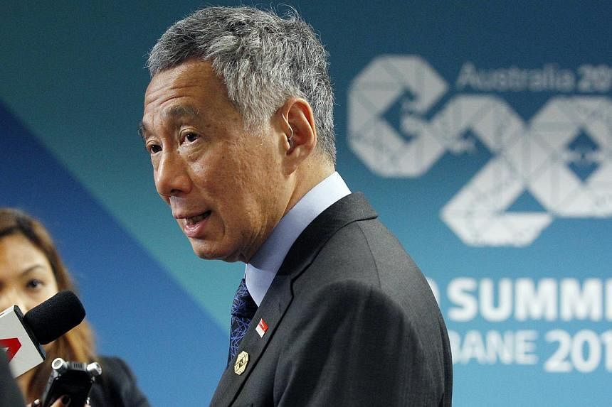 Prime Minister Lee Hsien Loong speaks to members of the Singapore media during a wrap-on session at the G-20 leaders Summit in Brisbane on Sunday, Nov 16, 2014.&nbsp;PM Lee said that the grouping must not lose focus of its core mandate of getting glo