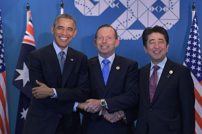 (From left) US President Barack Obama, Australia's Prime Minister Tony Abbott and Japan's Prime Minister Shinzo Abe at the G-20 Summit. -- PHOTO: AFP