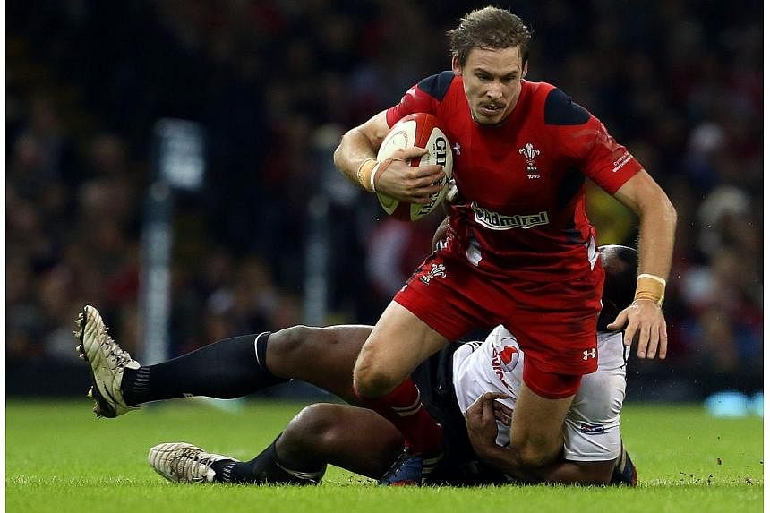 Wales' full back Liam Williams is tackled during the Autumn International rugby union Test match between Wales and Fiji at the Millennium Stadium in Cardiff, south Wales, on Novr 15, 2014. -- PHOTO: AFP