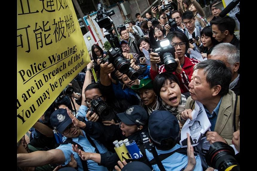 Protesters, seen here in a clash with police last week, have disrupted life in Hong Kong for almost two months now. Some political watchers think Beijing will tighten its grip on the territory after the dust settles.