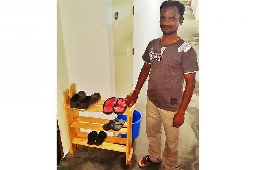 Contractor Raj Kumar with the shoe rack he built. --&nbsp;PHOTO: FACEBOOK PAGE OF PRIVEEN RAJ&nbsp;