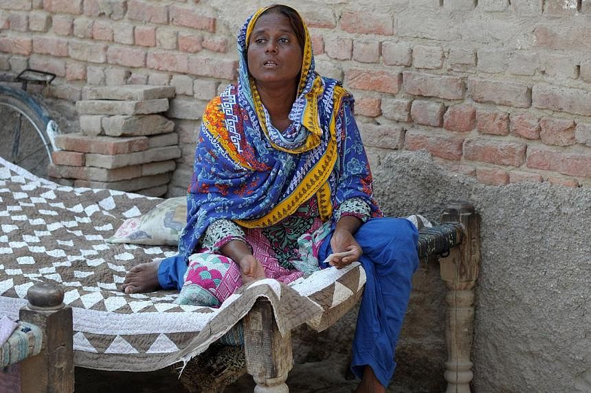 Pakistani villager Razia Shaikh, one of countless mothers to suffer the misery of "karo kari", gestures during an interview in Sukkur on Oct 18, 2014. -- PHOTO: AFP&nbsp;