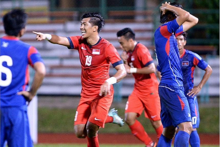 Singapore's Khariul Amri celebrates scoring his goal against Cambodia in a football friendly at Yishun Stadium on Nov 17, 2014.&nbsp;Singapore beat Cambodia 4-2 in a friendly match tonight for their second straight victory at Yishun Stadium, after ov
