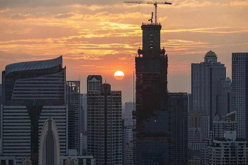 Thailand's planning agency trimmed its economic growth forecast for this year to 1.0 per cent from 1.5-2.0 per cent seen in August, citing weak exports. -- PHOTO: REUTERS