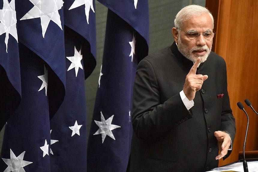 Indian Prime Minister Narendra Modi delivering a speech to members and senators at Parliament House in Canberra on Nov 18, 2014. -- PHOTO: AFP
