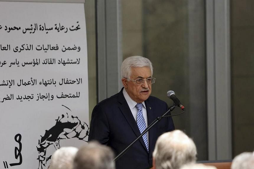 Palestinian President Mahmoud Abbas speaks at the opening of a museum of late Palestinian leader Yasser Arafat in the West Bank city of Ramallah on Nov 9, 2014.&nbsp;Palestinian President Mahmoud Abbas condemned an attack by two Palestinian men in a 