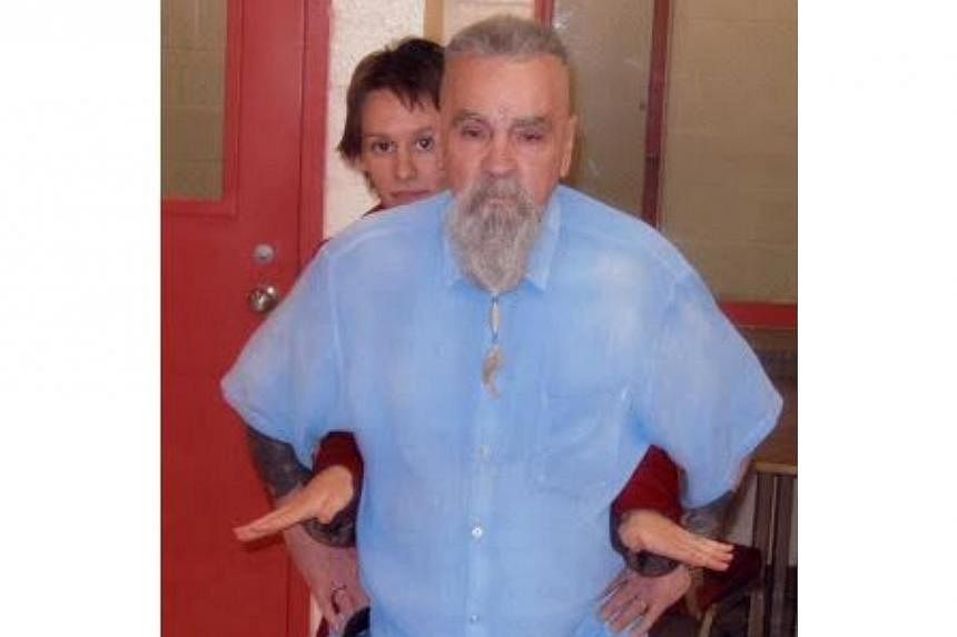 Convicted mass murderer Charles Manson (front), 80, has a licence to marry his girlfriend&nbsp;Elaine 'Star' Burton&nbsp;in prison in Corcoran, California, his home for the past 45 years. -- PHOTO: SCREENGRAB FROM MANSONDIRECT.COM