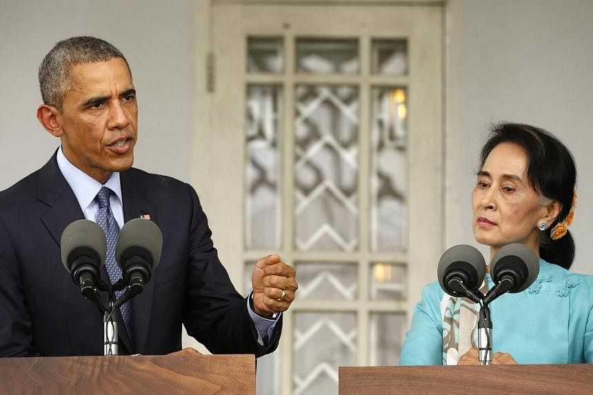 US President Barack Obama and opposition politician Aung San Suu Kyi hold a press conference after their meeting at her residence in Yangon on Nov 14, 2014. Myanmar's army is against changing a junta-drafted Constitution that bars Ms Suu Kyi from bec