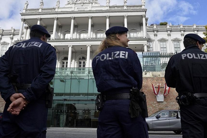 Police standing outside the Palais Coburg palace in Vienna, where the so-called EU 5+1 talks with Iran will take place on Oct 16, 2014 in this file picture. -- PHOTO: AFP