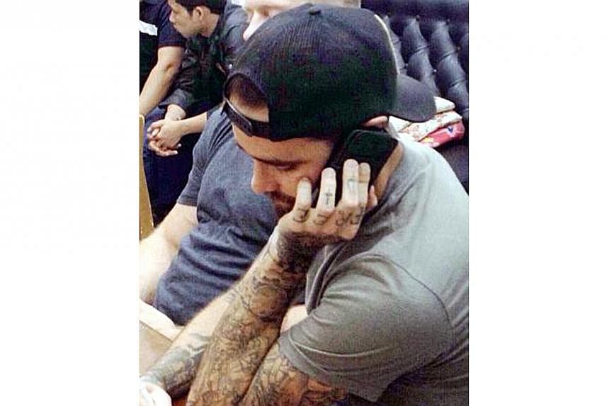 Heavily-tattooed, California Ryan Edward McPherson, seen in this image, has been interrogated by Thai police in the baby body parts case. -- PHOTO: THE NATION / ASIA NEWS NETWORK