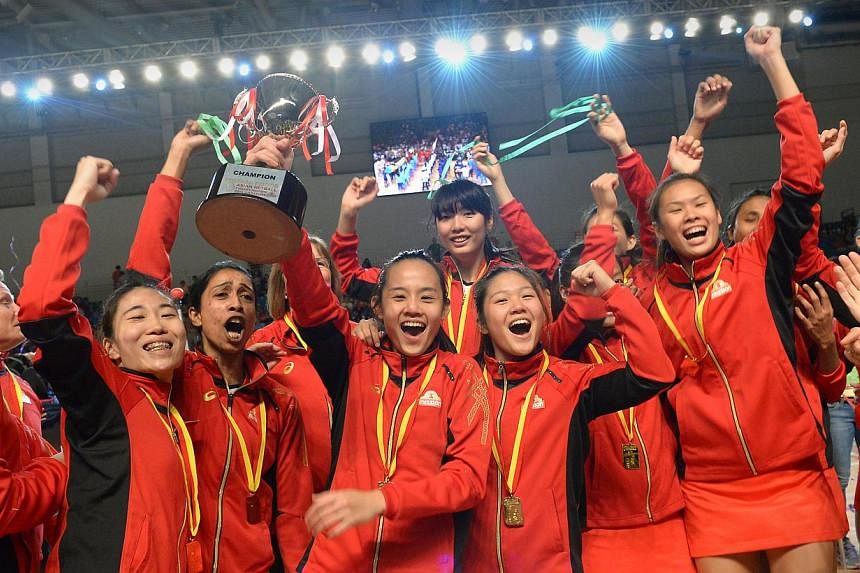 Members of Singapore’s victorious netball team celebrate their second successive Asian title after defeating arch rivals Sri Lanka 59-41 at the Mission Foods Asian Netball Championshops on Sept 14, 2014.&nbsp;The team that will represent Singapore 