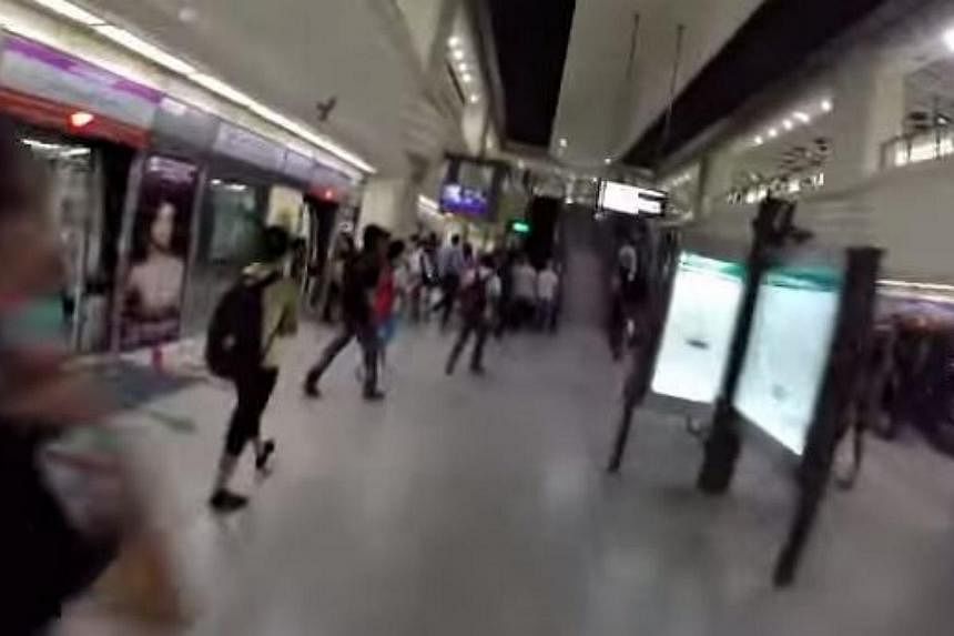 Four relay runners racing the MRT train from Little India to Farrer Park in a promotional video for the upcoming Asics City Relay run. -- PHOTO: SCREENGRAB FROM YOUTUBE&nbsp;