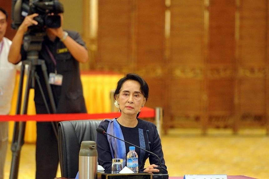Opposition leader Aung San Suu Kyi before her meeting with Myanmar President Thein Sein (not pictured) at his resident office in Naypyitaw on Oct 31, 2014. Myanmar will not change its Constitution until after a general election late next year, compli