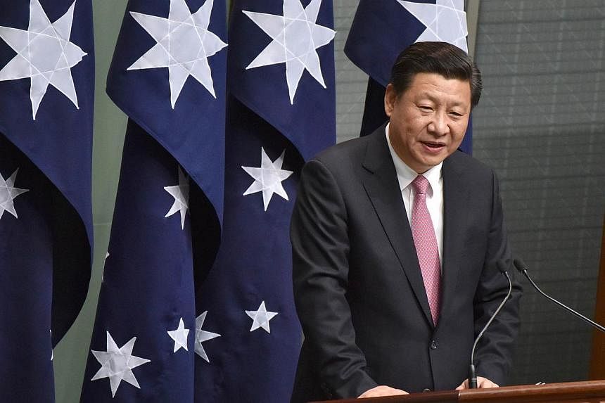 China's President Xi Jinping addresses the Australian Parliament during his visit to Canberra on Nov 17, 2014. -- PHOTO: AFP