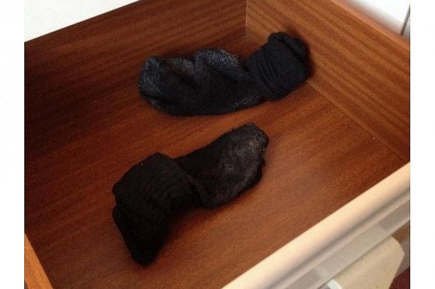 A traveller who posted a photo of dirty socks in a drawer for a review of Blackpool's Broadway Hotel on travel website TripAdvisor. -- PHOTO: SCREENGRAB FROM TRIPADVISOR.COM&nbsp;
