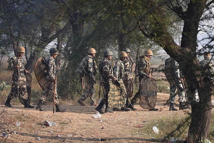 Indian police personnel arrive near the ashram of self-styled 'godman' Rampal Maharaj in Hisar, some 175km north of New Delhi on Nov 19, 2014.&nbsp;&nbsp;Police discovered five bodies on Wednesday after storming the ashram of a wanted guru in norther