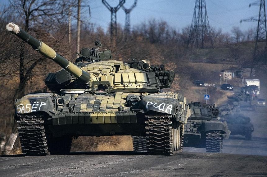 A column of pro-Russian separatists tanks rides near the town of Krasnyi Luch in Lugansk region, eastern Ukraine, on Oct 28, 2014.&nbsp;Britain's embassy in Kiev risked provoking fresh Russian ire Wednesday by posting a diagram on Twitter "to help th