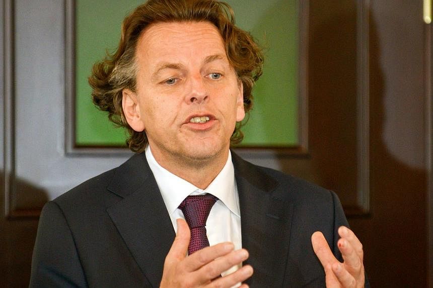 Ukrainian security services claimed on Tuesday to have thwarted a plot against Dutch Foreign Minister Bert Koenders (above) as he paid his respects to the victims of downed Malaysia Airlines flight MH17 on Nov 8, 2014. -- PHOTO: AFP &nbsp;