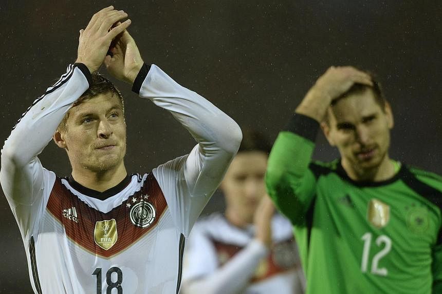 Germany's midfielder Toni Kroos celebrates at the end of the friendly football match Spain vs Germany at the Balaidos stadium in Vigo on Nov 18, 2014. -- PHOTO: AFP&nbsp;