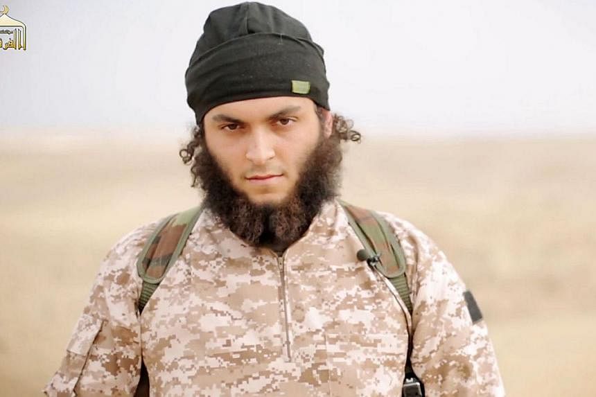 An image grab taken from a propaganda video released on Nov 16, 2014 by al-Furqan Media allegedly shows Mickael Dos Santos, a jihadist believed to be French citizen and member of the Islamic State in Iraq and Syria (ISIS) jihadist group, who also goe