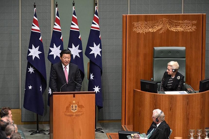 China's President Xi Jinping addressing the Australian Parliament during his visit to Canberra on Nov 17, 2014. Mr Xi is visited Canberra after attending the G-20 Summit in Brisbane over the weekend. -- PHOTO: AFP