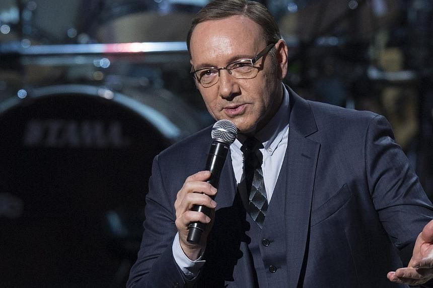 Actor Kevin Spacey speaks during a tribute concert in honour of singer Billy Joel, recipient of the 2014 Library of Congress Gershwin Prize for Popular Song, at DAR Constitution Hall in Washington, DC on Nov 19, 2014. -- PHOTO: AFP
