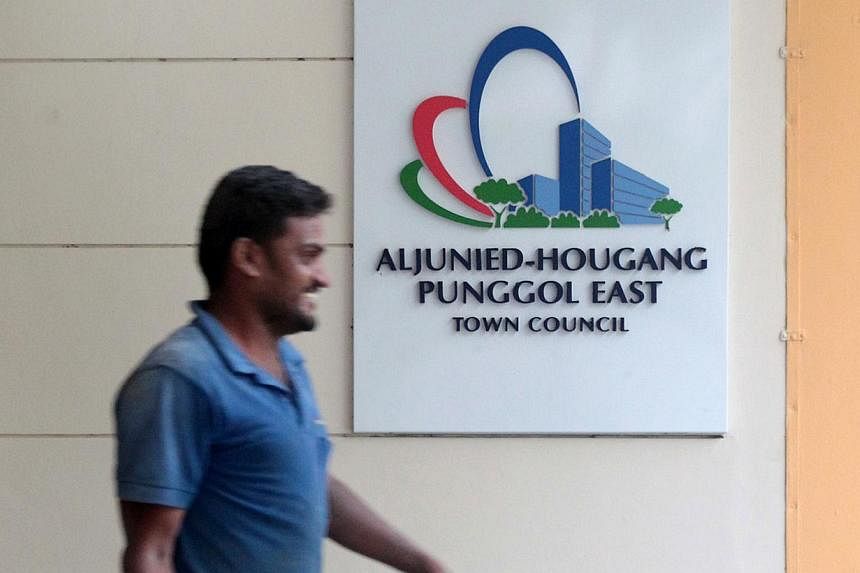 A man walks past the Aljunied-Hougang-Punggol East town council at Rivervale Crescent in Sengkang on April 17, 2014.&nbsp;The Ministry of National Development (MND) has explained how the Government disburses grants to town councils, and how much of a
