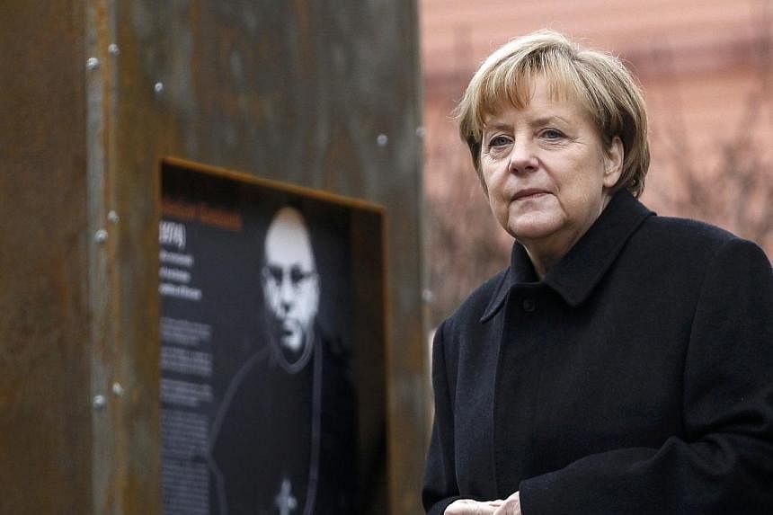 German Chancellor Angela Merkel views an exhibition during an official ceremony in the village of Krzyzowa on Nov 20, 2014.&nbsp;Russia is key to ensuring European security, German Chancellor Angela Merkel said Thursday as she marked a quarter centur
